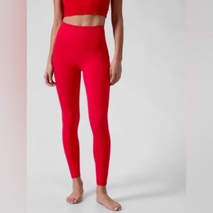 Athleta Salutation Stash tight, size Large, candy red